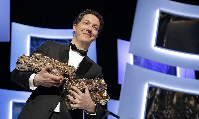 French actor and director Guillaume Gallienne poses with his trophies during the 39th Cesar Awards ceremony in Paris
