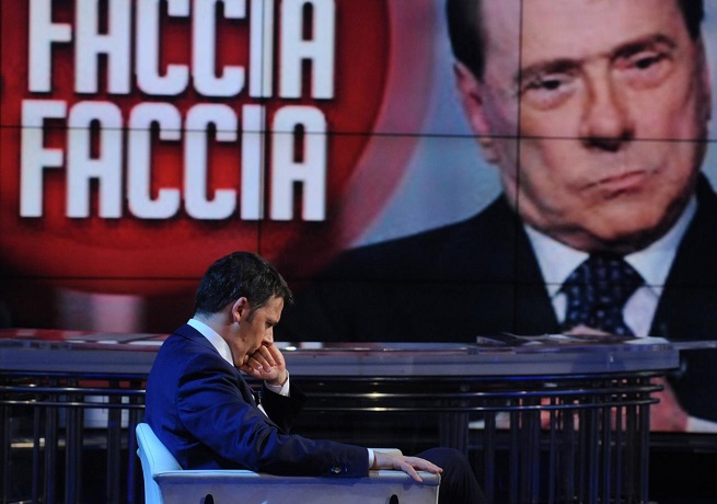 Renzi dal vivo e Berlusconi sul maxischermo di 'Porta a Porta' (Foto AdnKronos)